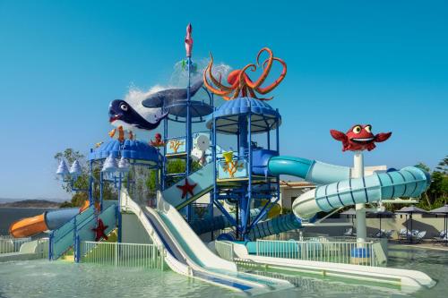 a water park with a water slide in the water at Iberostar Waves Creta Panorama & Mare in Panormos Rethymno