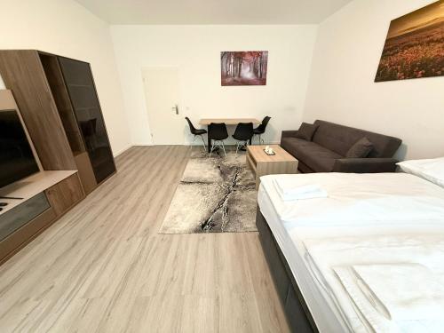 a living room with a couch and a table at Domloge Lofts & Apartments in Cologne