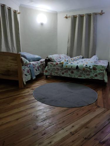 Katil atau katil-katil dalam bilik di Galapagos Homestay