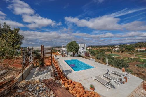 an image of a villa with a swimming pool at Amazing T1 -Alvor in Alvor