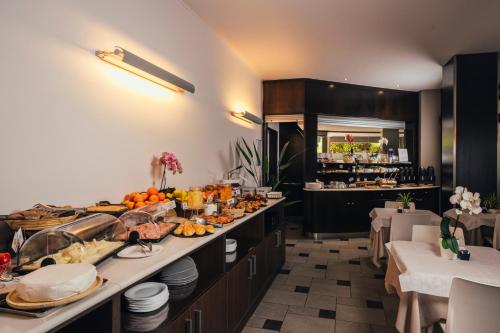 a buffet line in a restaurant with a lot of food at Euro Hotel in Imola