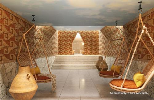 una stanza con due sedie a dondolo e una scala di Majestic Mirage Costa Mujeres, All Suite Resort - All Inclusive a Cancún