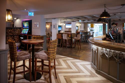 a bar with chairs and a counter in a restaurant at Lodge at Solent in Fareham