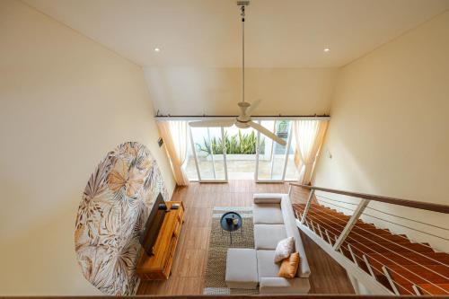 an overhead view of a living room with a staircase at Cove Lotus Lofts Seminyak in Seminyak