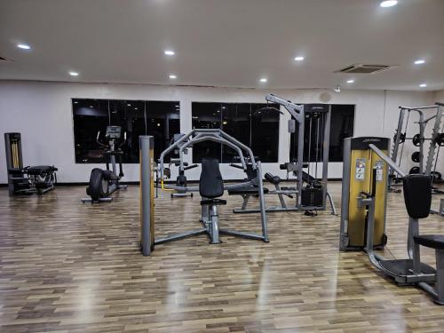 a gym with treadmills and machines in a room at Swiss Garden resort residence by Moonlight in Kuantan