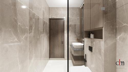 a bathroom with a shower and a toilet and a sink at Beach & Bliss Mirissa in Mirissa