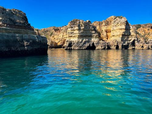 a view of a body of water with rocks at Apartamento Familiar Old Town in Lagos