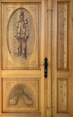 a door with a painting of a man on it at Sklep "OSUD" in Mutěnice