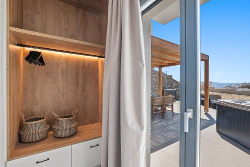 a kitchen with a view of the patio from a house at Coastal Retreat Naxos in Naxos Chora