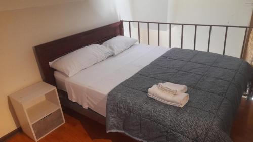 Una cama o camas en una habitación de Edificio catedral