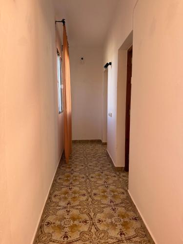 an empty hallway with a tile floor at Nature in Tejeda in Tejeda