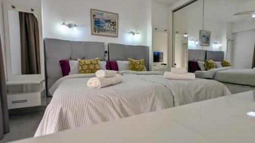 Voodi või voodid majutusasutuse Modern Apt near Beach&Pool Coastal Sunset Tenerife toas