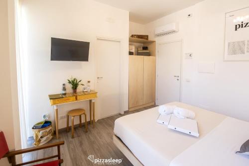 Cama o camas de una habitación en PizzaSleep B&B