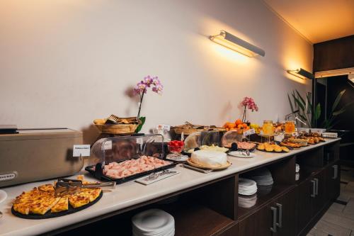 a buffet line with many different types of food at Euro Hotel in Imola