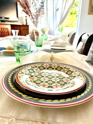 a table with a plate on top of a table at Pensiunea La Meleta in Şurdeşti