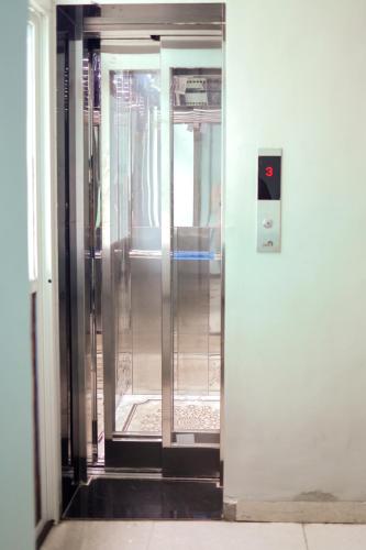 an entrance to a building with a revolving door at Hotel shiv ganga in Ujjain