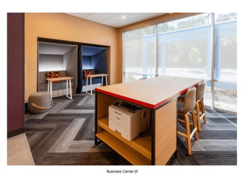 an office with a desk and chairs in a room at Tru By Hilton in Commerce