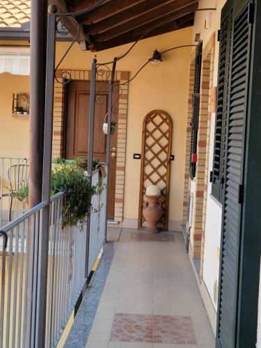 a front door of a house with a gate at Le Camere Di Aladino in Carugate