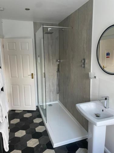 a bathroom with a shower and a sink at Gordons in Cheddar