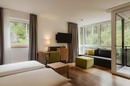 Postel nebo postele na pokoji v ubytování Waldrast - Forestside Living