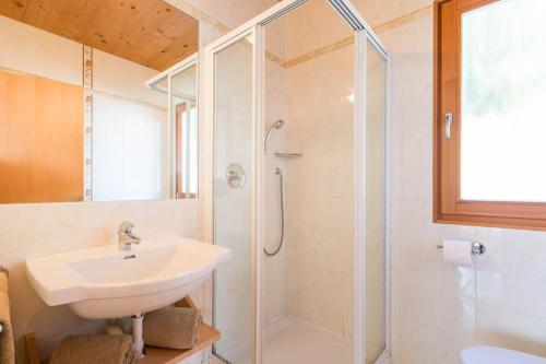 a bathroom with a sink and a shower at AppartmentPircher 2 in Siusi