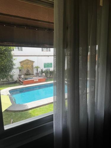 Bazén v ubytování Hotel Portal de Reyes nebo v jeho okolí