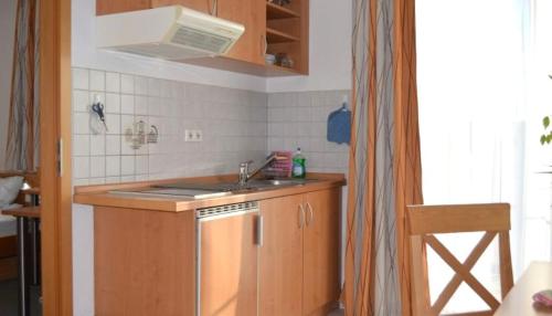 a kitchen with a sink and a counter top at City Hotel in Böblingen