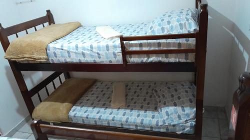 a couple of bunk beds in a room at Trem Bão de Dormir in Recife