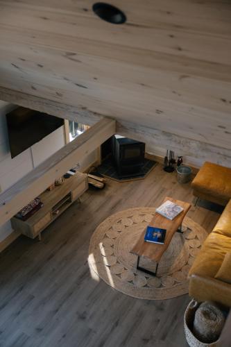 a living room with a couch and a table at Arrow Head Cabin in Killington