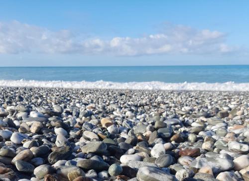 a large group of rocks on a beach at B&B Il Gabbiano in Cittadella del Capo
