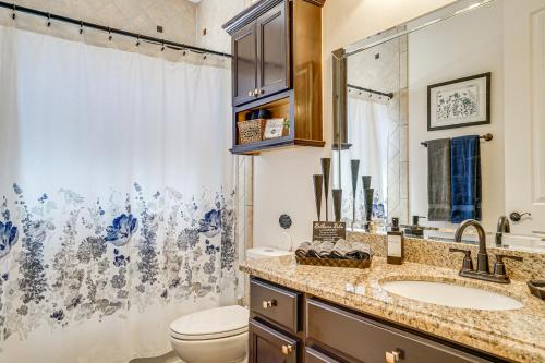 a bathroom with a sink and a toilet and a mirror at Family-Friendly El Paso Home Hike, Shop and Explore in Santa Teresa