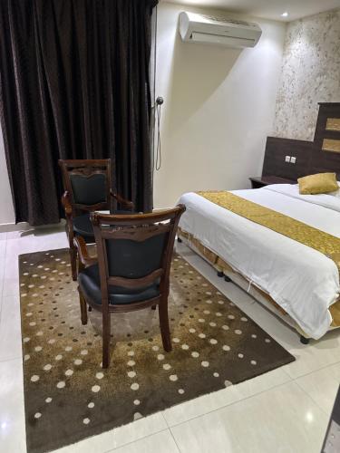 En eller flere senge i et værelse på شقق روز للشقق المخدومة