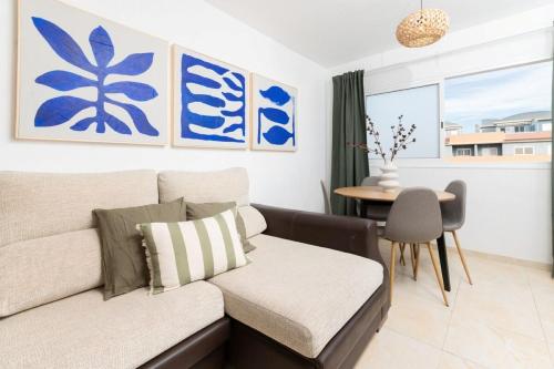 a living room with a couch and a table at Brisas de Güimar in Santa Cruz de Tenerife