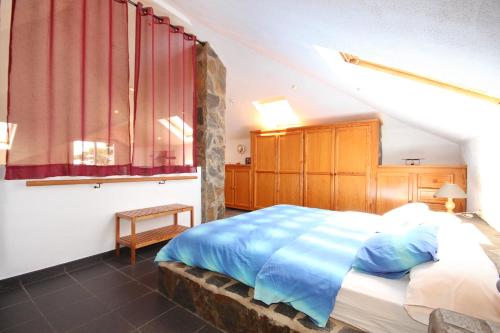 a bedroom with a large bed with blue sheets at VV Complejo Vacacional VillaMaría in Los Llanos de Aridane