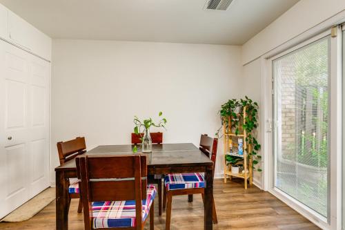 a dining room with a table and chairs and a window at 3 Mi to Dulles Airport D C Area Townhome in Herndon
