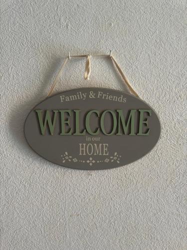 a welcome sign hanging on a wall at Hisa Lina Near Bovec in Srpenica