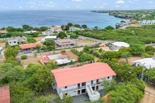 an aerial view of a town with a red roof at Vista Papaya Suites in Westpunt