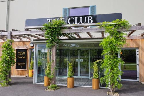 a building with a sign that reads club at voco The Club - Dublin Gateway by IHG in Naas