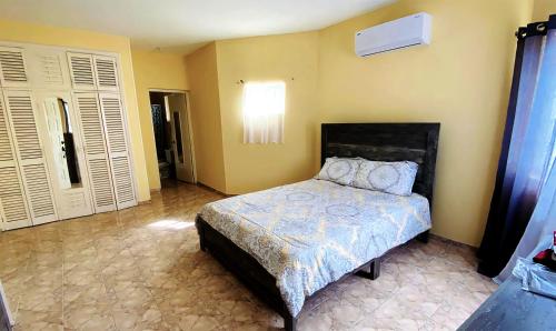 a bedroom with a bed in a room at Ocean JB Tower Isle in Tower Isle