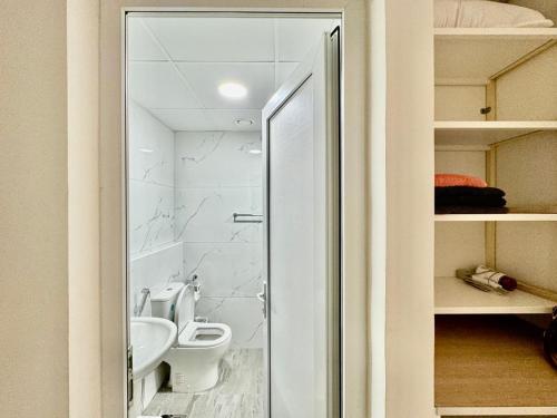 a bathroom with a toilet and a sink at Stunning studio with balcony close to metro in Dubai