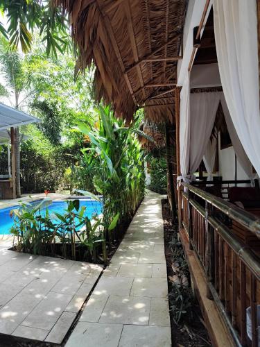 an outside view of a resort with a swimming pool at Black Bamboo in Puerto Viejo