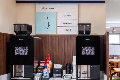 two coffee machines sitting on a counter in a room at Garner Hotel Liberty Lake by IHG in Liberty Lake