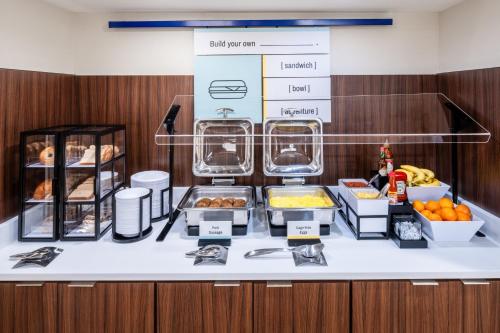 a buffet with food on a counter in a room at Garner Hotel Liberty Lake by IHG in Liberty Lake