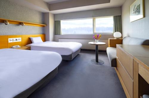 Ένα ή περισσότερα κρεβάτια σε δωμάτιο στο ANA Crowne Plaza Resort Appi Kogen by IHG