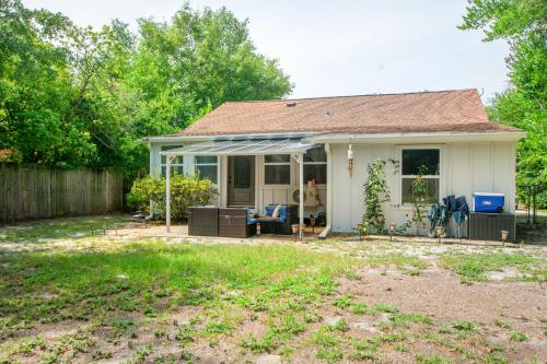 a small white house with a patio at Down By The Bay St Andrews Gem in Panama City