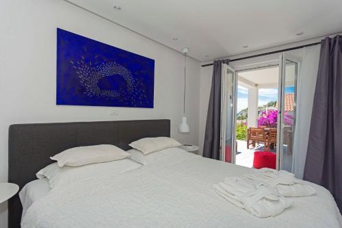 Postel nebo postele na pokoji v ubytování Blue Bay Residence