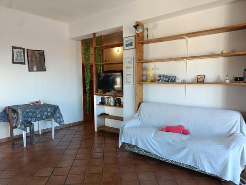 a bedroom with a bed and a table with a table at Casa Panorama Viterbo Senza ZTL e Parcheggio Gratuito in Viterbo