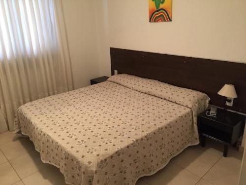 Ένα ή περισσότερα κρεβάτια σε δωμάτιο στο Hotel Nuevo Premier