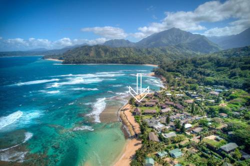 an aerial view of a beach with houses and the ocean at Hanalei Colony Resort F3 in Hanalei