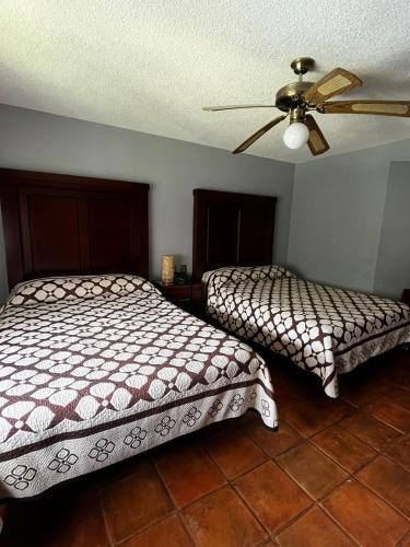 Postel nebo postele na pokoji v ubytování Hotel Portal de Reyes